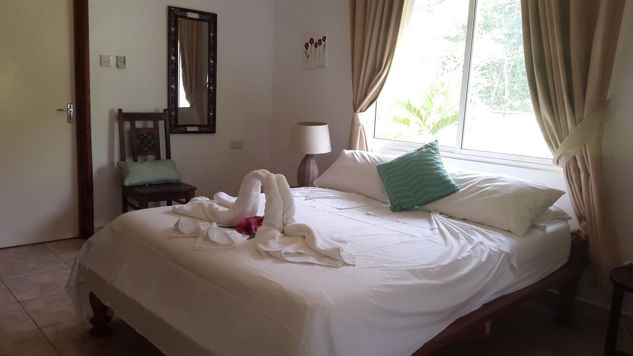 Paodise Guesthouse La Digue Quarto foto